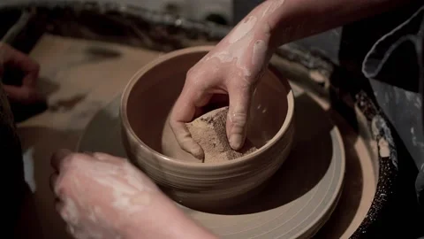 Create of ceramic bowl on a turntable. Art of pottery. Young lady hands Stock Footage 201568642