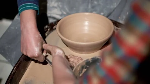 Create of ceramic bowl by young lady with help of teacher. Pottery workshop Stock Footage 201568641