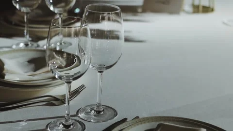 Create an Elegant Table Setting with Beautiful Wine Glasses for an Impressive Stock Footage 308395454