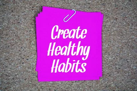 Create Healthy Habits text message on stick note on cork paper background Stock Photos
