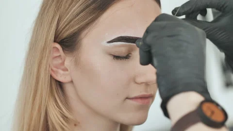 Create permanent eyebrow makeup. Create permanent eyebrow makeup. Thread peeling Stock Footage 115885586