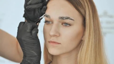Create permanent eyebrow makeup. Eyebrow discoloration and peeling of old paint. Stock Photos
