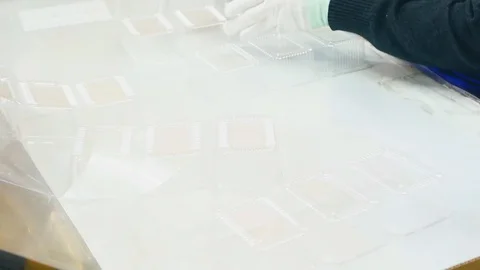 Create plastic package and pack. Goods manufactured of plastic packing from Stock Footage 127747376