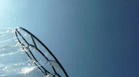 Create a whimsical bubble with the device. Bubbles Flying in the Sky Stock-Footage 67090871