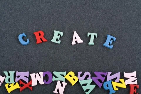 CREATE word on black board background composed from colorful abc alphabet b.. Foto stock