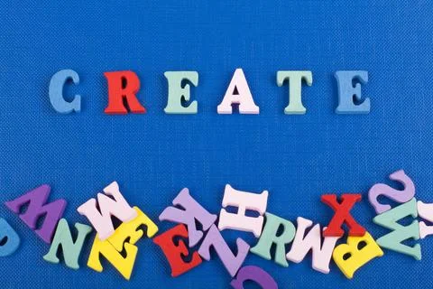 CREATE word on blue background composed from colorful abc alphabet block wo.. 스톡 사진