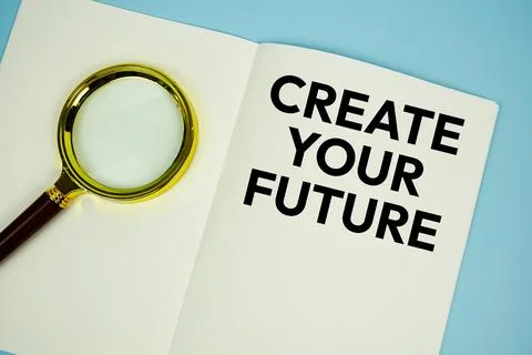 Create Your Future text with magnifying glass flat lay on notepad background Stock Photos