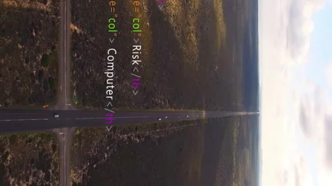 Creating animation, HTML code overlay on aerial road view through vast landscape Stock Footage 313412738