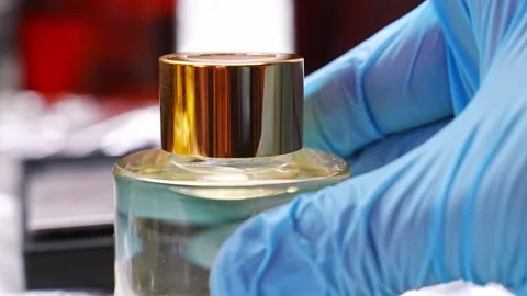 Creating aroma diffusers using alcohol and aromatic oils in careful assembly Stock Footage 304500796