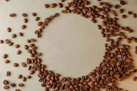 Creating art with coffee beans on a rustic surface at dawn Stock Photos