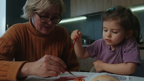 Creating Art Together A Special Bond between Grandmother and Granddaughter Stock Footage 277183207