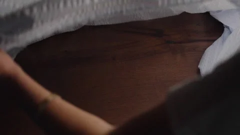 Creating the Atmosphere- Laying a Tablecloth- Stock Footage 287636788