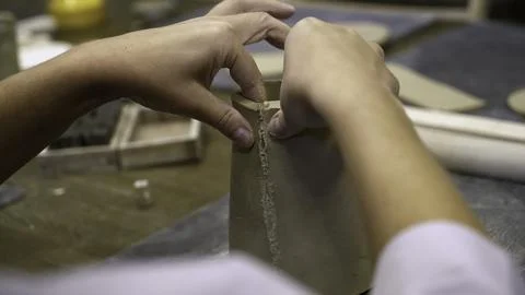 Creating a Beautiful and Functional Ceramic Pot Hands Skillfully at Work in Stock Photos