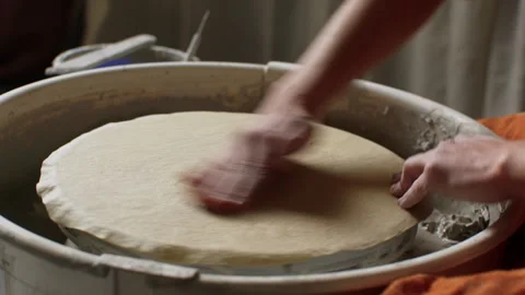 Creating beautiful ceramic art with skilled pottery hands in a studio Stock Footage 321540697