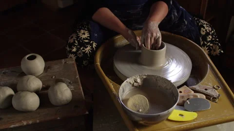 Creating beautiful ceramic pots with hands on a pottery wheel Stock Footage 321542559