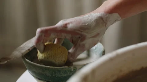 Creating beautiful ceramic pottery with hands and clay in a workshop Stock Footage 321541015