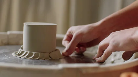 Creating beautiful ceramic pottery with skilled hands in a studio Stock Footage 321541810