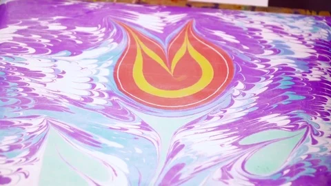 Creating beautiful flower on water using the ebru technique closeup Stock Footage 74720151