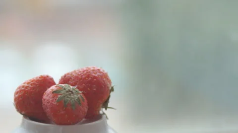Creating a bed of sweet white whipped cream for a red ripe strawberry Stock Footage 68955040