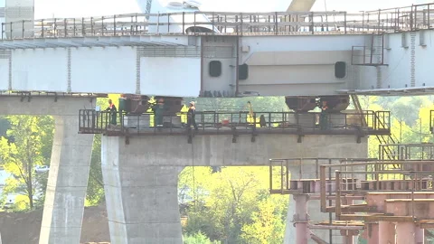 Creating a bridge across the river Stock Footage 98666395