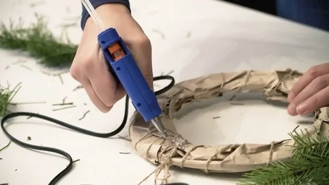 Creating a Christmas wreath with decorations. Close-up Stock Footage 70963481