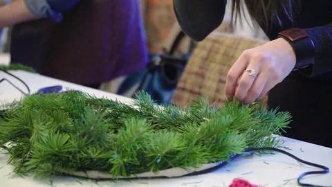 Creating a Christmas wreath with decorations. Close-up Stock Footage 70965088