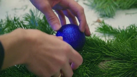 Creating a Christmas wreath with decorations. Close-up Stock Footage 70966796