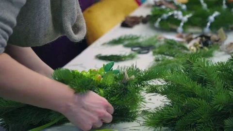 Creating a Christmas wreath with decorations. Close-up Stock Footage 70968961