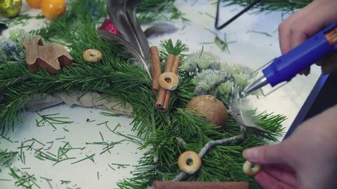 Creating a Christmas wreath with decorations. Close-up Video stock 70973233
