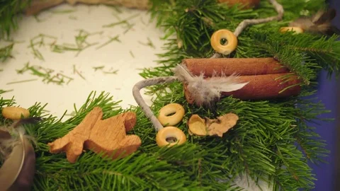Creating a Christmas wreath with decorations. Close-up Video stock 70973320