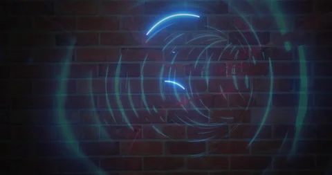 Creating circular designs, neon blue light patterns on brick wall background Stock Footage 303675729