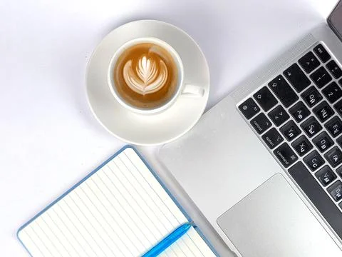 Creating a Comfortable and Efficient Workspace using Coffee and a Laptop fo.. Stock Photos