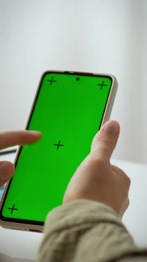 Creating content with a smartphone featuring a green screen for video editin Stock Footage 331541189