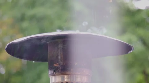 Creating a Cozy and Inviting Outdoor Heating Experience During Rainy and Wet Stock-Footage 304729148
