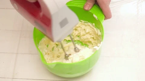 Creating a cream for a tasty cake slow motion Stock Footage 74585837