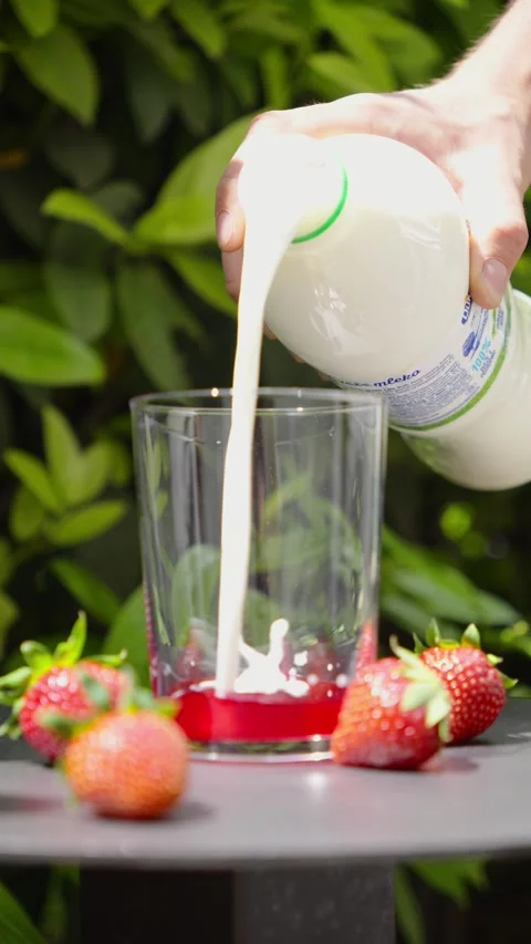 Creating Creamy Milk Layer with Strawberry Syrup, Slow Motion Stock Footage 338447866