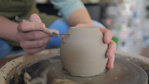 Creating cup of white clay close-up.Girl makes cup out of clay closeup Stock Footage 119544073