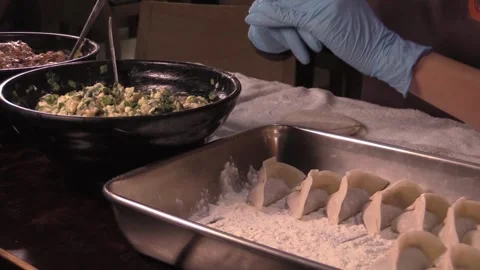Creating delicious dumplings with fresh ingredients Stock Footage 323792584