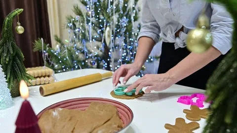 Creating delightful gingerbread men to celebrate Christmas joy Stock Footage 344819660