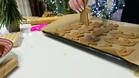 Creating delightful gingerbread men to celebrate a joyous Christmas Stock Footage 344821850