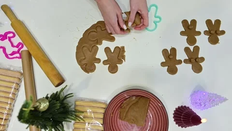 Creating delightful gingerbread men for a cheerful Christmas Video stock 344820894