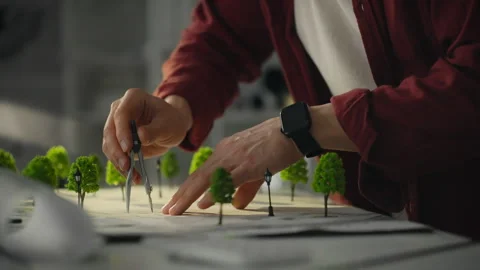 Creating a detailed model landscape with trees and careful measurements in a Stock Footage 323733952