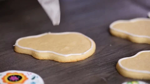 Creating edge for flooding sugar skull cookie with royal icing. Stock Footage 97193095