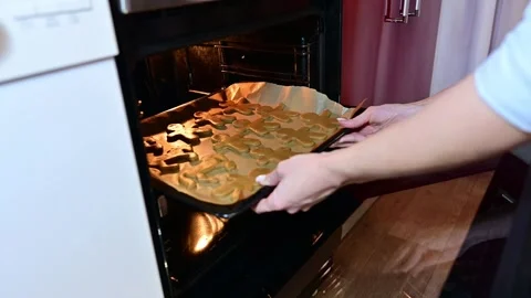 Creating festive gingerbread cookies with love during the holiday season Stock Footage 344820832