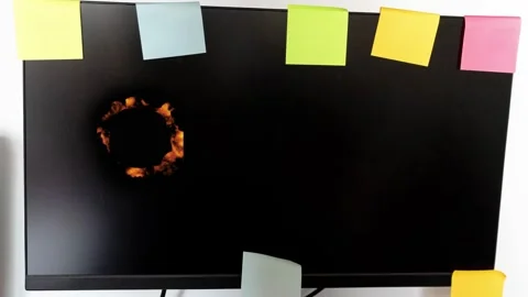 Creating a fire ring on a blank computer screen with sticky notes Stock Footage 342831596