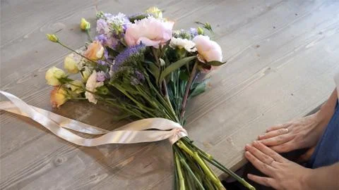 Creating flower bouquet in workshop.. Stock Photos
