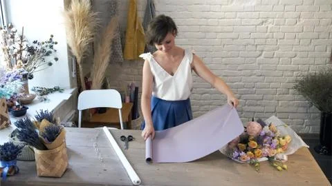 Creating flower bouquet in workshop.. Stock Photos