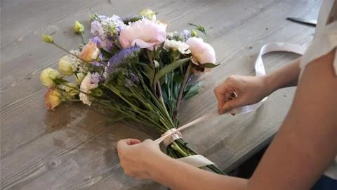 Creating flower bouquet in workshop.. Stock Photos