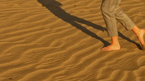 Creating footprints in the sand Stock Footage 106189127