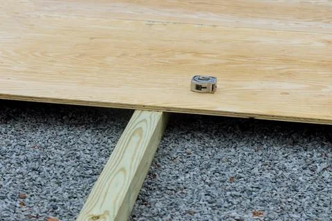 Creating the foundation for a small shed in the backyard by building a wood deck Fotos de archivo